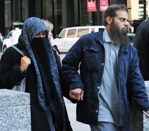 The parents of Mohammed Hamzah Khan, a 19-year-old U.S. citizen from Bolingbrook, Ill., leave the Dirksen federal building Monday, Oct. 6, 2014 in Chicago.