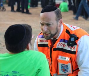 An Israeli EMT in an MCI drill with a special needs patient.