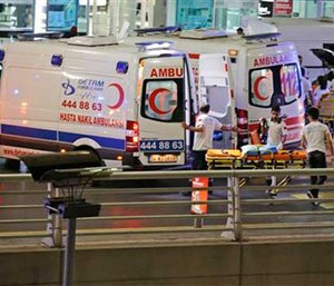 Turkish rescue services gather outside Istanbul's Ataturk airport, Tuesday, June 28, 2016.