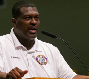 Sgt. Stanley Jean-Poix, president of the Miami Community Police Benevolent Association, speaks to Miami city leaders about concerns his organization has about racial discrimination in the police department. (Photo/TNS)
