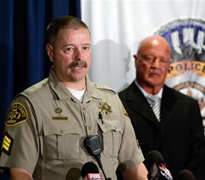 Salt Lake County Sheriff's Sgt. Terry Wall, left, talks about using his crisis intervention training to calm a passenger down on a direct flight from New York to Salt Lake City during a news conference in Salt Lake City on Monday, Jan. 5, 2015.