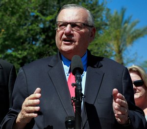 In this May 22, 2018, file photo, former Maricopa County Sheriff Joe Arpaio speaks during a campaign event in Phoenix. Arpaio filed a defamation lawsuit against three news organizations on Monday, Dec. 10, alleging that their inaccurate references to his criminal case have hurt his chances in possibly running in 2020 for the Senate.