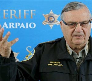 In this Dec. 18, 2013 file photo, Maricopa County Sheriff Joe Arpaio announces dozens of arrests in a prostitution sting during a news conference at Maricopa County Sheriff's Office Headquarters in Phoenix.