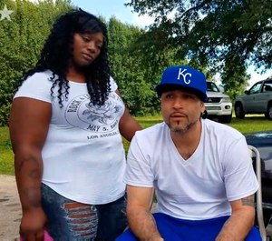 Richard Anthony Jones, right, with his girlfriend Nakisha Duncan of Kansas City at his side, talks about being released from prison in Kansas City, Mo. Kansas has agreed to pay $1.1 million to Jones who spent 17 years in prison after being wrongfully convicted of a robbery that he says was committed by someone who looks just like him. (Toriano Porter/The Kansas City Star via AP)