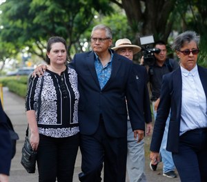 Former deputy prosecutor Katherine Kealoha, center left, and husband, former Honolulu police chief Louis Kealoha, center right, walk toward Queen Street after the verdict in their corruption case at federal court in Honolulu. (Photo/AP)