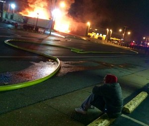 EMS1 video producer Ray Kemp, embedded with fire and EMS, captured this as he and bystanders watched buildings burn in Ferguson, Mo.