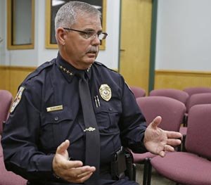 In this July 16, 2014 photo, Police Chief Terry Isaacs talks about two officers no longer in his department in Fruitland Park, Fla. Two police officers at this department are no longer with the city after a law enforcement report tied them to the Ku Klux Klan.
