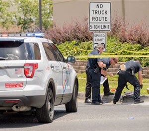 Jefferson Parish Sheriff Officers respond to the shooting death of a deputy who initiated a pedestrian stop in front of a Dunkin' Donuts Wednesday, June 22, 2016.
