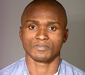 Charley Saturmin Robinet after his arrest for robbery. (AP Image)