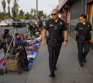 Officers in cities like Los Angeles are receiving training and resources to prepare them for interactions with immigrant communities where Spanish or English are not spoken. (Photo/TNS)