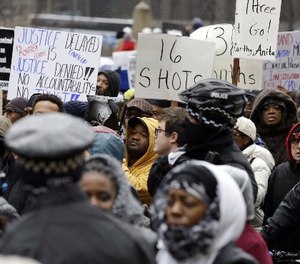 In this Nov. 27, 2015, file photo, protesters take part in a