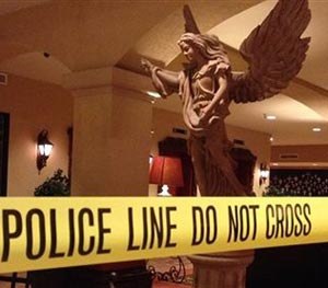 This Tuesday, Oct. 28, 2014 photo provided by the Las Cruces Police Department shows a closed off area of the Hotel Encanto in Las Cruces, NM. after a shooting.