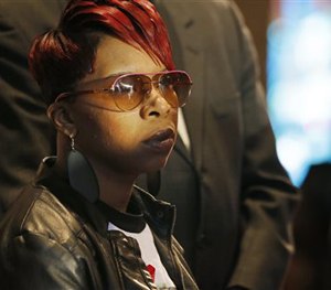 In this March 5, 2015, file photo, Lesley McSpadden, mother of Michael Brown Jr., listens to the family attorney during a news conference. (AP Image)