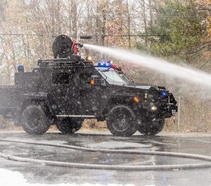 A BearCat X3– FireCat shoots water from a roof-mounted nozzle.