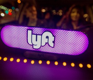 Lyft's new Amp glows on the dashboard of a car in San Francisco.
