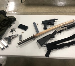 Police reported finding several weapons in the vehicle of Aaron Swenson, who was charged with making terroristic threats.