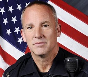 This undated photo provided by the Rio Rancho Police Department shows Officer Gregg Benner. (AP Image)