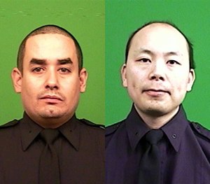 Officer Rafael Ramos (left) and Officer Wenjian Liu were shot and killed Saturday, Dec. 20, 2014, in the Brooklyn borough of New York.