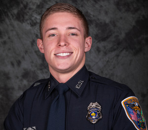 Patrolman Logan Redmon helped get a man suspected of DUI off the train tracks moments before a train hit the man's vehicle.