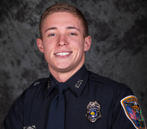Patrolman Logan Redmon helped get a man suspected of DUI off the train tracks moments before a train hit the man's vehicle.