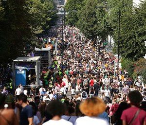 Crowds attend the Family Day at the Notting Hill Carnival in west London. (Yui Mok/PA via AP)