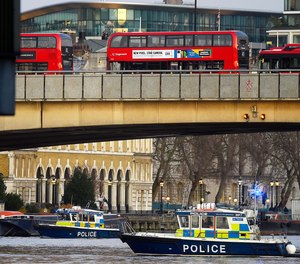 Boats from the Metropolitan Police Marine Policing Unit patrol near the scene after people were reported injured during a stabbing on London Bridge, police have said, on Friday, Nov. 29, 2019 in London, England.