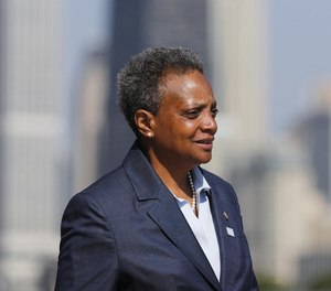 Mayor Lori Lightfoot speaks to the media regarding pausing the water meter program the before attending the Chicago Police Department graduation and promotions ceremony at Navy Pier in Chicago on July 9, 2019. (Jose M. Osorio/Chicago Tribune/TNS)