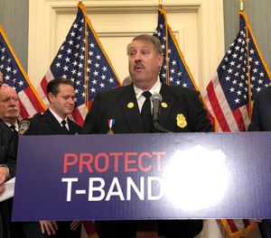 Members of U.S. Congress and public safety leaders, including IAFC President Gary Ludwig, held a press conference to call for the passage of legislation that would prevent the FCC from auctioning of the T-band spectrum, which is used for first responder communications throughout the country.