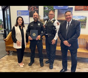 Officer Zachary Lukon, pictured center left, received a proclamation for his bravery from the Westmoreland County Commissioners.