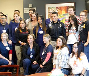 Staff of the emergency room at Spring Valley Hospital and first responders pose for a photo with survivors.
