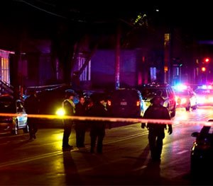 Madison Police investigate the scene of a shooting on Williamson Street, late Friday.