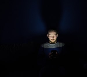 Checking your smartphone while in bed may be contributing to your insomnia.
