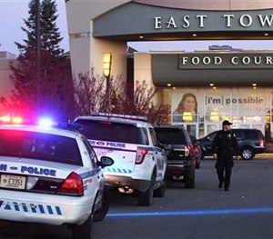 Authorities respond to reports of shots fired at East Towne Mall in Madison, Wis., Saturday, Dec. 19, 2015.