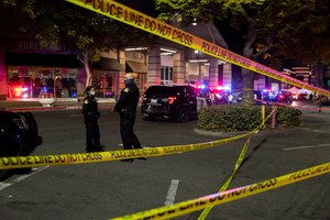 Police stand outside Arden Fair Mall after a shooting, Friday, Nov. 27, 2020, in Sacramento, Calif.