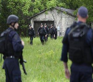 Law enforcement officers search for escaped prisoners near Essex, N.Y., Tuesday, June 9, 2015.