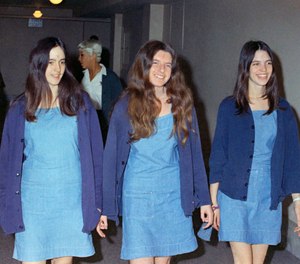 In this Aug. 20, 1970, file photo, Charles Manson followers, from left, Susan Atkins, Patricia Krenwinkel and Leslie Van Houten walk to court to appear for their roles in the 1969 cult killings of seven people in Los Angeles. (AP Photo/George Brich, File)