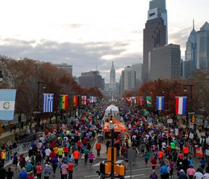 Runners make their way down Benjamin Franklin Parkway in Philadelphia during the Philadelphia Marathon.