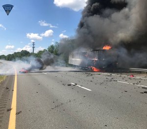 Firefighters and police responded to a tractor-trailer fire when another vehicle struck a police cruiser, causing the cruiser to hit a firefighter. A Massachusetts state trooper and the firefighter were transported to the hospital. (Photo/Massachusetts State Police)