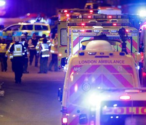 Emergency personnel on London Bridge after an incident in central London. (Dominic Lipinski/PA via AP)