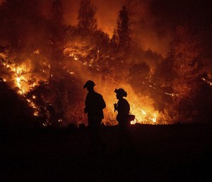 Firefighters monitor a backfire while battling the Ranch Fire, part of the Mendocino Complex Fire.