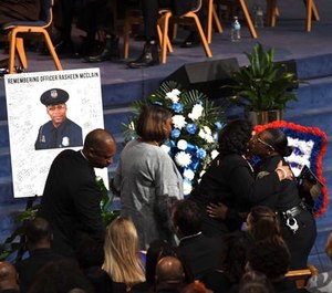 Hundreds of police officers were joined by civilians Friday at Officer Rasheen McClain's funeral. (Photo/TNS)