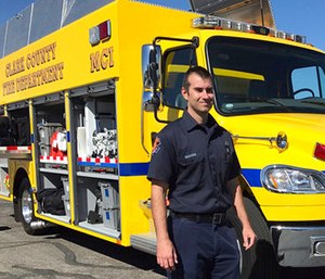 Clark County Fire Department engineer Brian Emery stands by one of his agency's Mass Casualty Incident vehicles in Las Vegas.