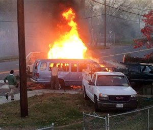 Flames rise from a vehicle following a fatal crash Sunday. (Steve Ramsey via AP)