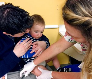 August Goepferd received the measles, mumps and rubella booster shot at a clinic at Children's Minnesota in Minneapolis. (AP Photo/Amy Forliti)