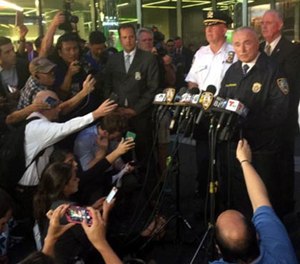 NYPD Commissioner William J. Bratton addresses the media after a homeless man with a meat cleaver hit an off-duty detective in the face Thursday afternoon at the end of a foot pursuit through midtown Manhattan.