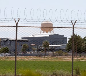 In this July 23, 2014 file photo, a fence surrounds the state prison in Florence, Ariz., where the execution of Joseph Rudolph Wood took place. (AP Photo/File)