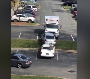 Police arrested a man who is accused of stealing an ambulance and then using it to crash into vehicles in a parking lot. (Photo/Screenshot)