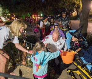 MedStar personnel take children with medical needs trick-or-treating.