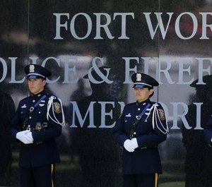The Fort Worth Police Honor Guard stands at the memorial wall at the Fort Worth Police Department annual Peace Officers Memorial Service in Trinity Park, in this May 4, 2016 file photo.