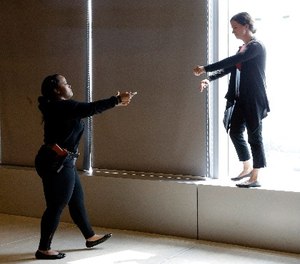 In this Sept. 2, 2015 file photo, Sgt. Cecilia Luckie, left, talks actress Erin Shields, off a ledge during a Crisis Intervention Training class at the New York Police Department Police Academy, in New York. (AP Photo/Mary Altaffer, File)